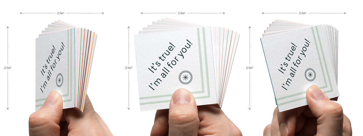 Hand holding luxe square business card at different angles