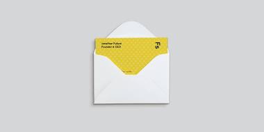 Open mini Envelope containing a yellow Business Card