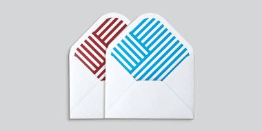 2 medium Envelopes with geometric patterns on the inside, 1 red and 1 blue