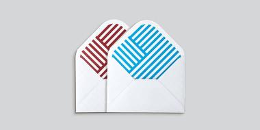 2 small Envelopes with geometric patterns on the inside, 1 red and 1 blue