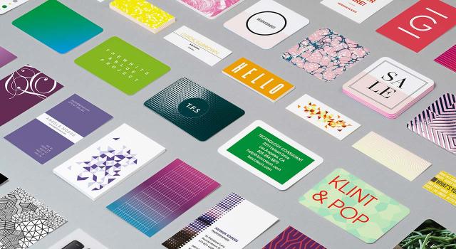 Mosaic of Business Cards in various designs on grey background