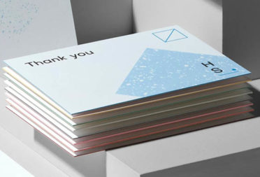 Stack of extra-thick Luxe Postcards with a colored edge