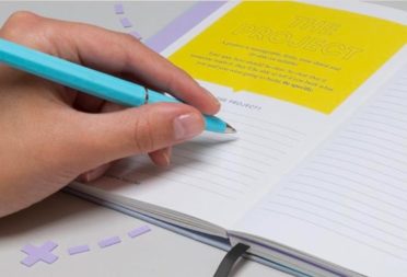 Hand writing in a MOO notebook designed by Seth Godin