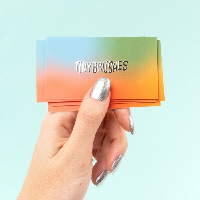 Orange, yellow, blue and green gradient business cards with silver foil logo by Tiny Brushes