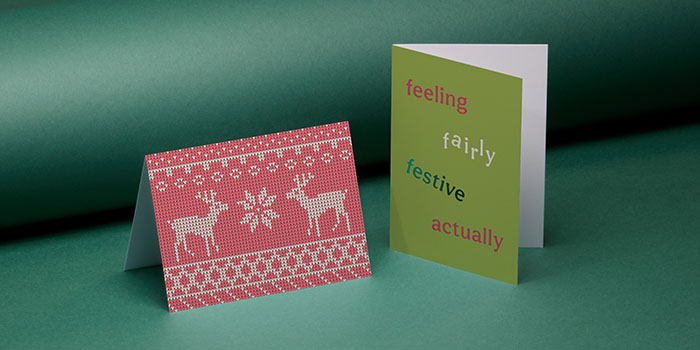 Two folded greeting cards with festive designs