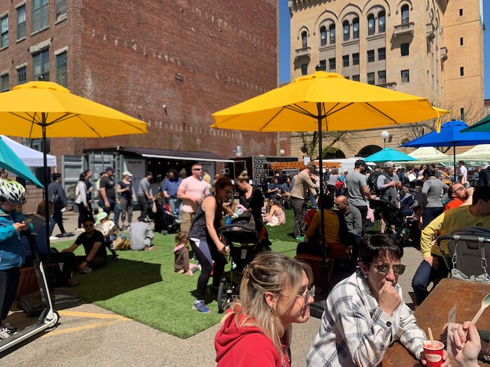SoWa Boston open market with tables and sun shades