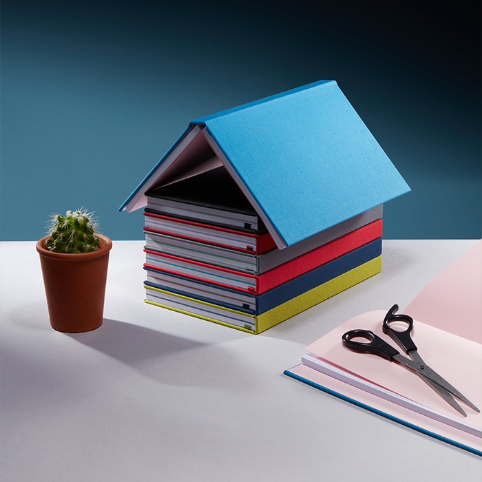 Piled up Notebooks in different colors.