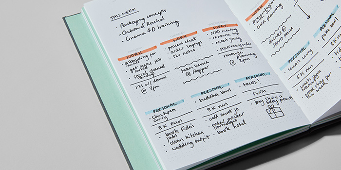A business planner being used to plan out weekly work tasks and activities 