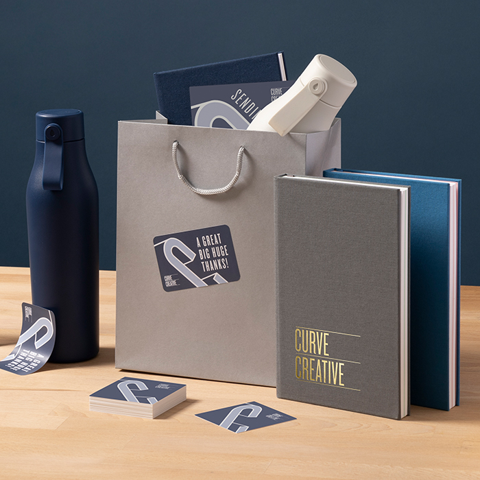 Branded corporate gifting can include custom Notebooks and Water Bottles.