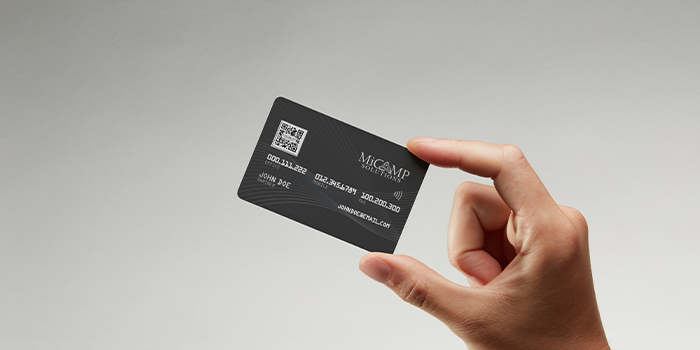 A monochrome, rounded business card design for MiCamp, designed and printed by MOO