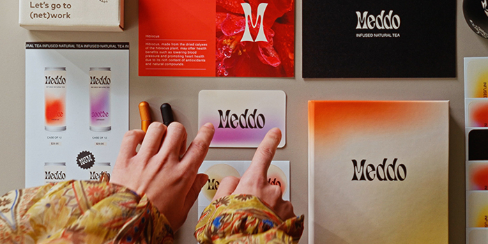 Print and Branded Merch on table.