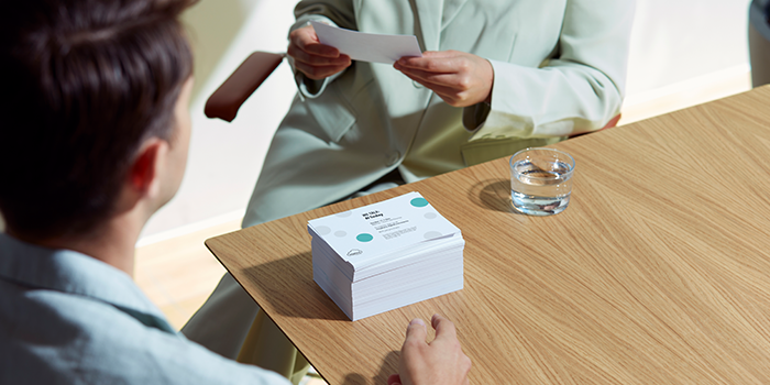 Person holding eco paper.