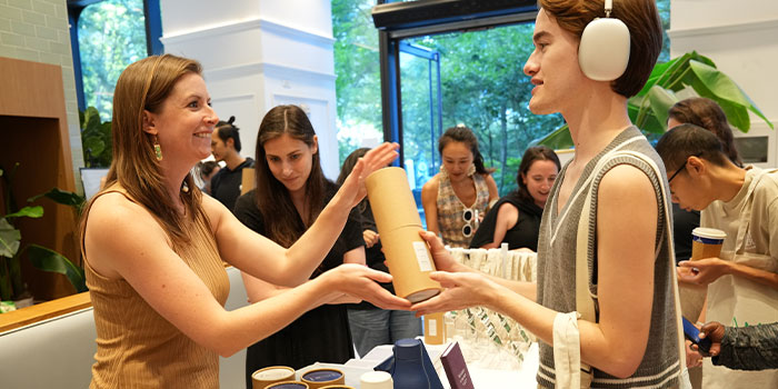 Guests getting free Water Bottles and Notebooks.