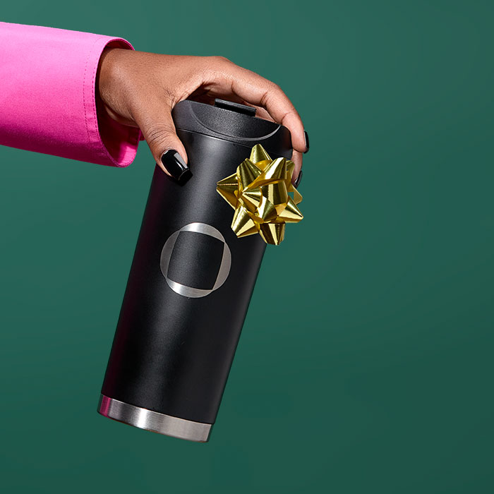 Someone holding a Larq Water Bottle.