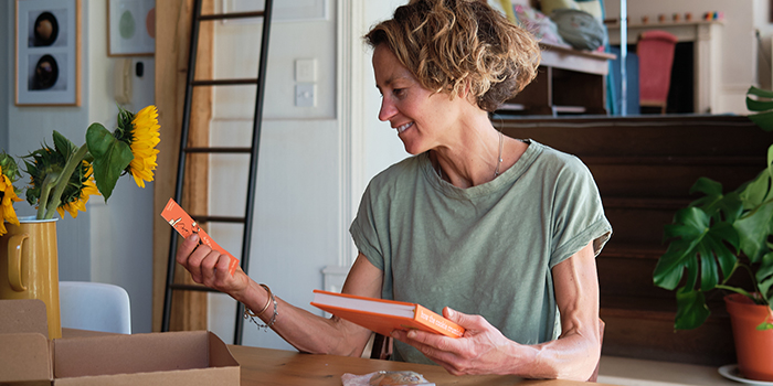 Tara holding her book and bookmark.
