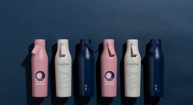 Six customised bottles on a blue background