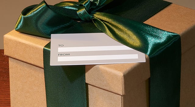 Christmas box with ribbon and card