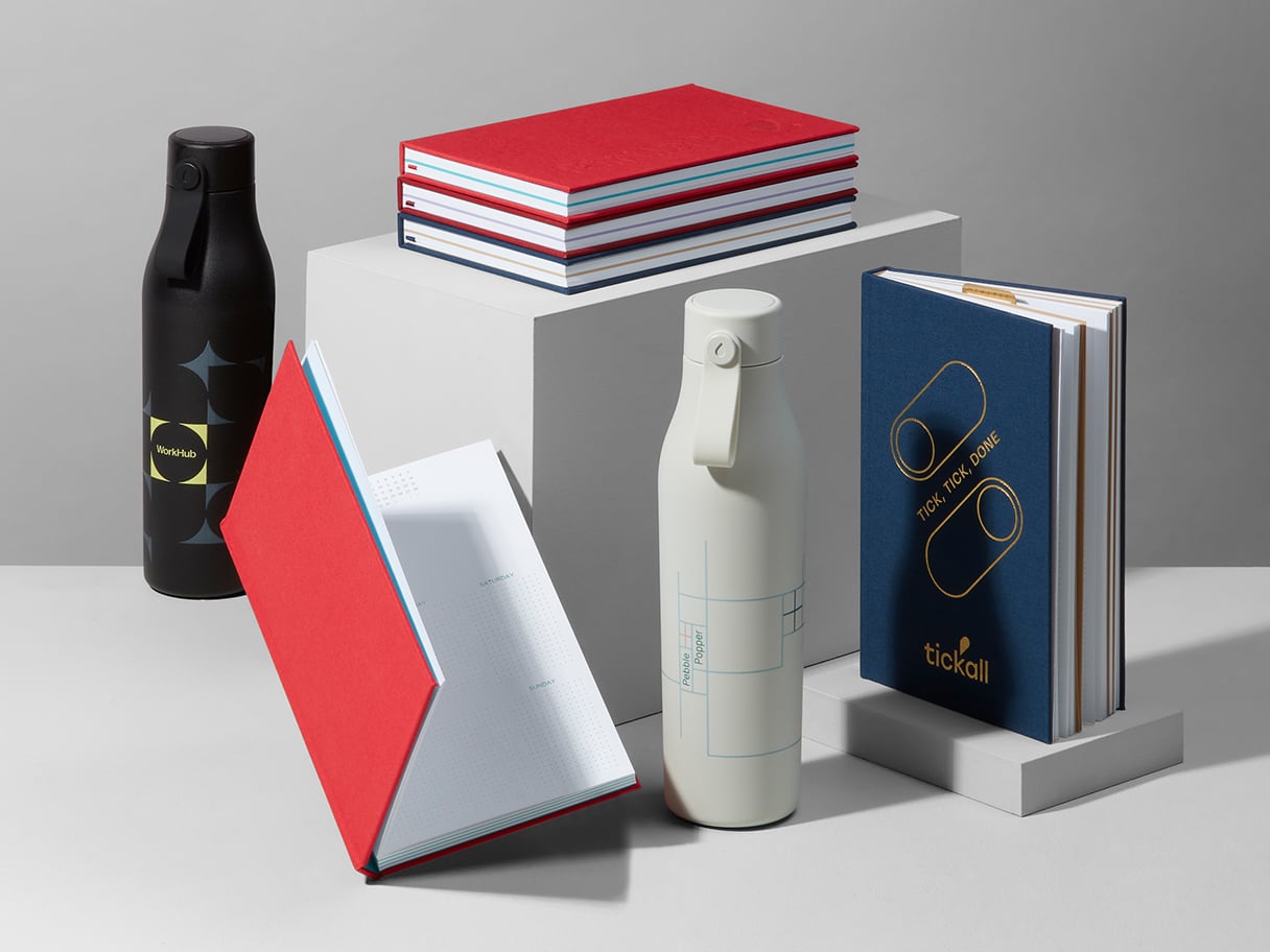 Custom MOO Water Bottles, Perpetual Planner and Hardcover Notebooks on display