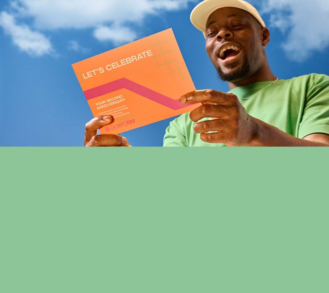A person holding a postcard