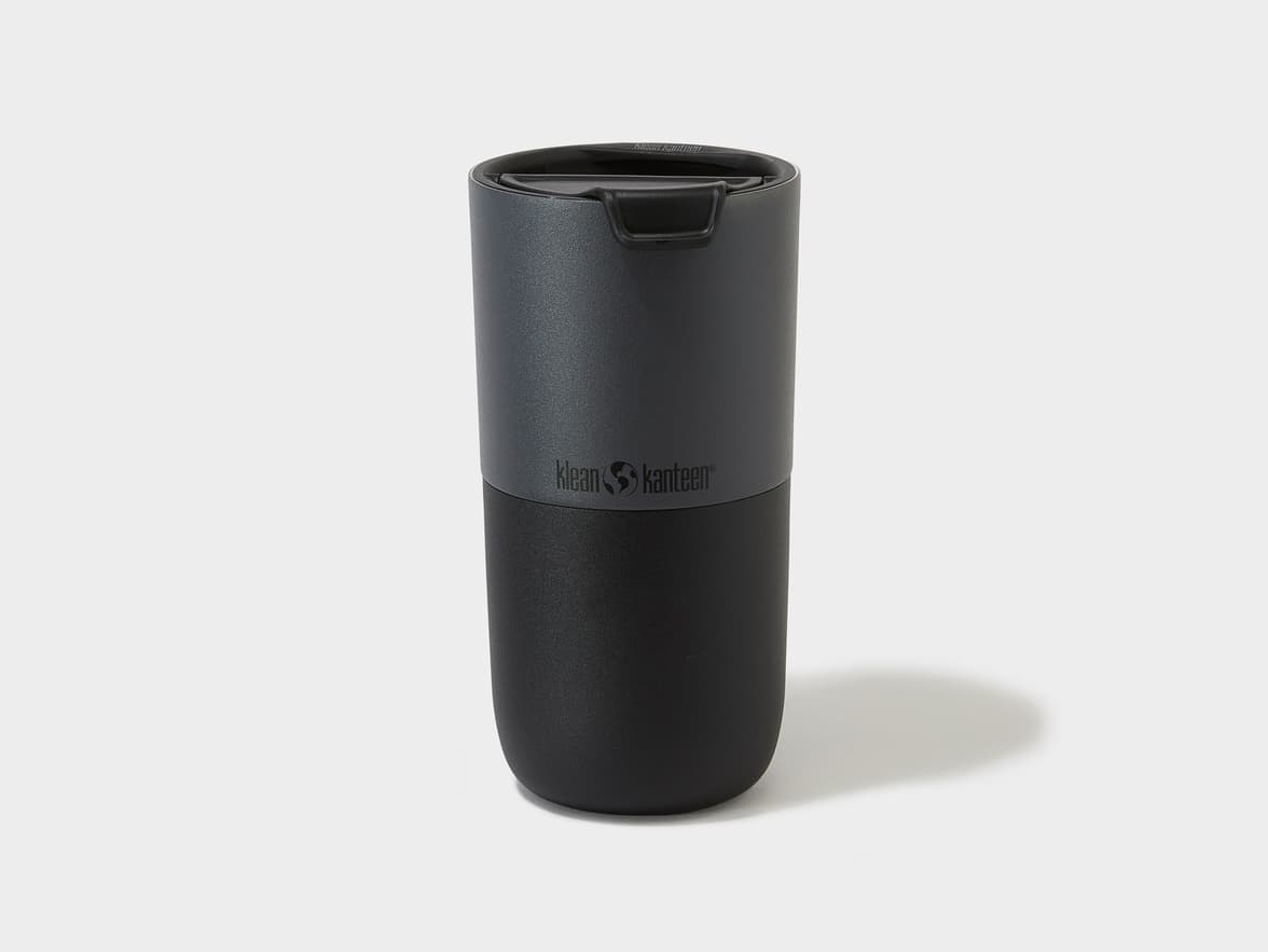 Black and dark grey Klean Kanteen tumbler with a flip-top lid.