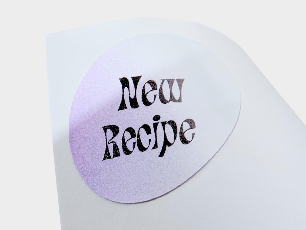 A close up image of a lilac customized round coated sticker.