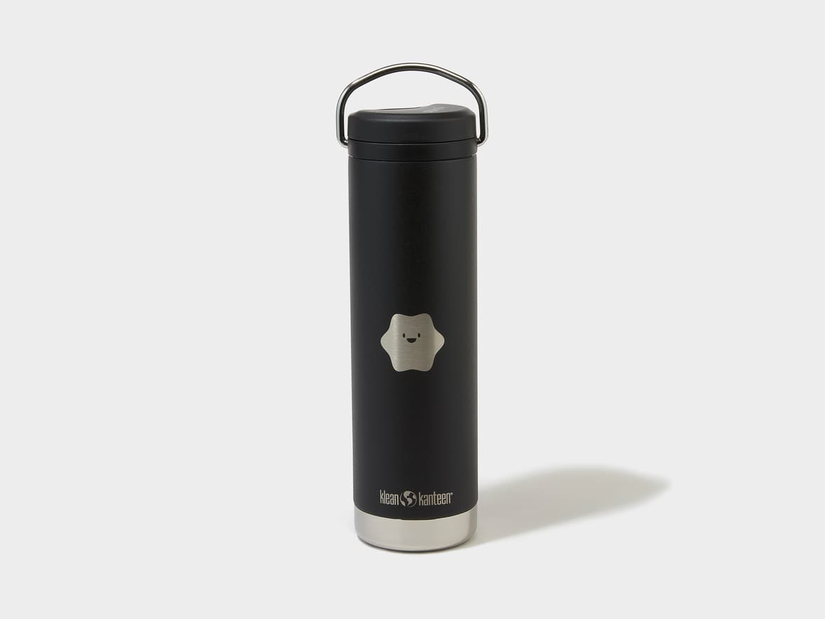 Black Klean Kanteen bottle with a silver handle and a smiling star emblem.