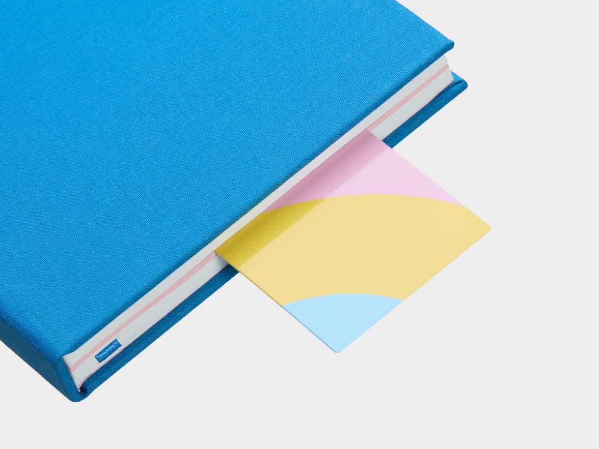 Original gloss bookmark sticking out of book.