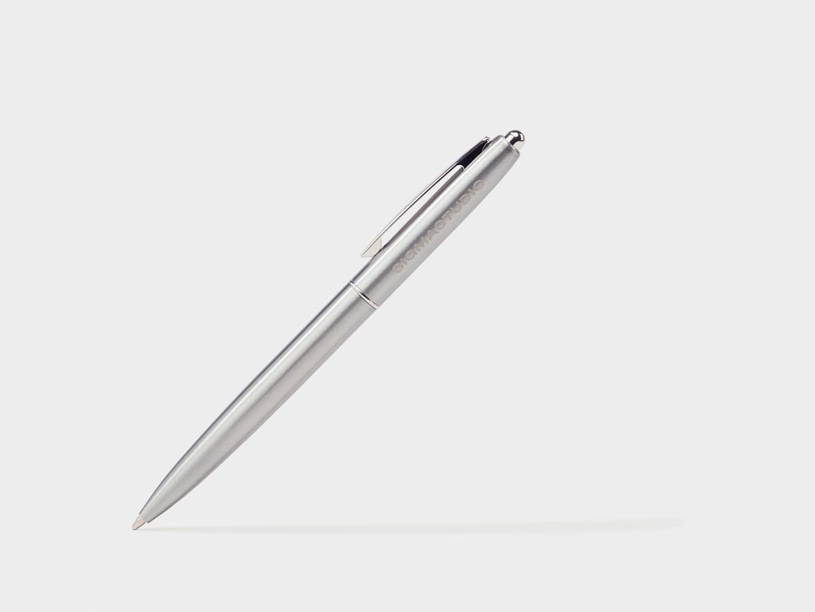A silver pen with "SIGMA STUDIO" branding.