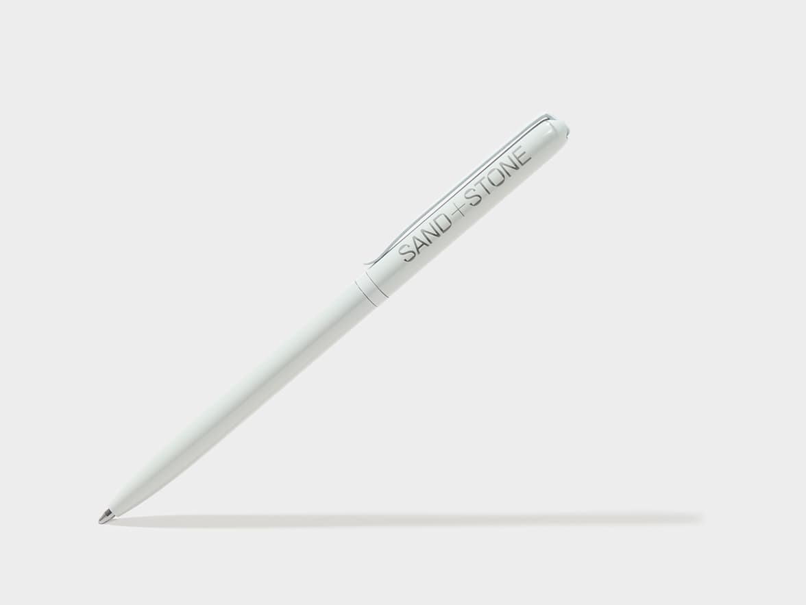 White pen branded "SAND + STONE".