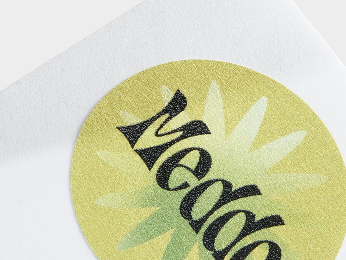 A detail image of a round customized matte paper sticker in size 1.5.