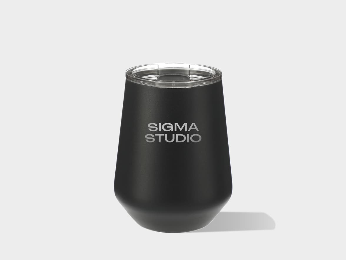 Black "SIGMA STUDIO" branded tumbler with a clear lid.