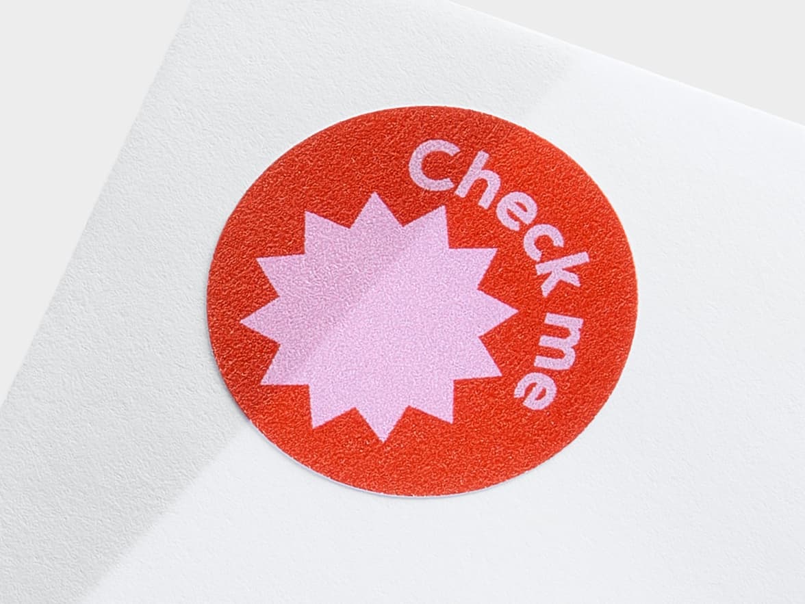 A close up image of a customized round matte paper sticker in size 1 inch.