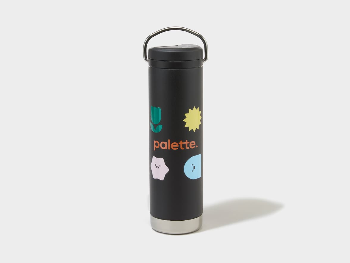 Black bottle with black cap, silver handle, and 'palette.' brand name, alongside a green tulip, yellow sun, pink and blue shapes.