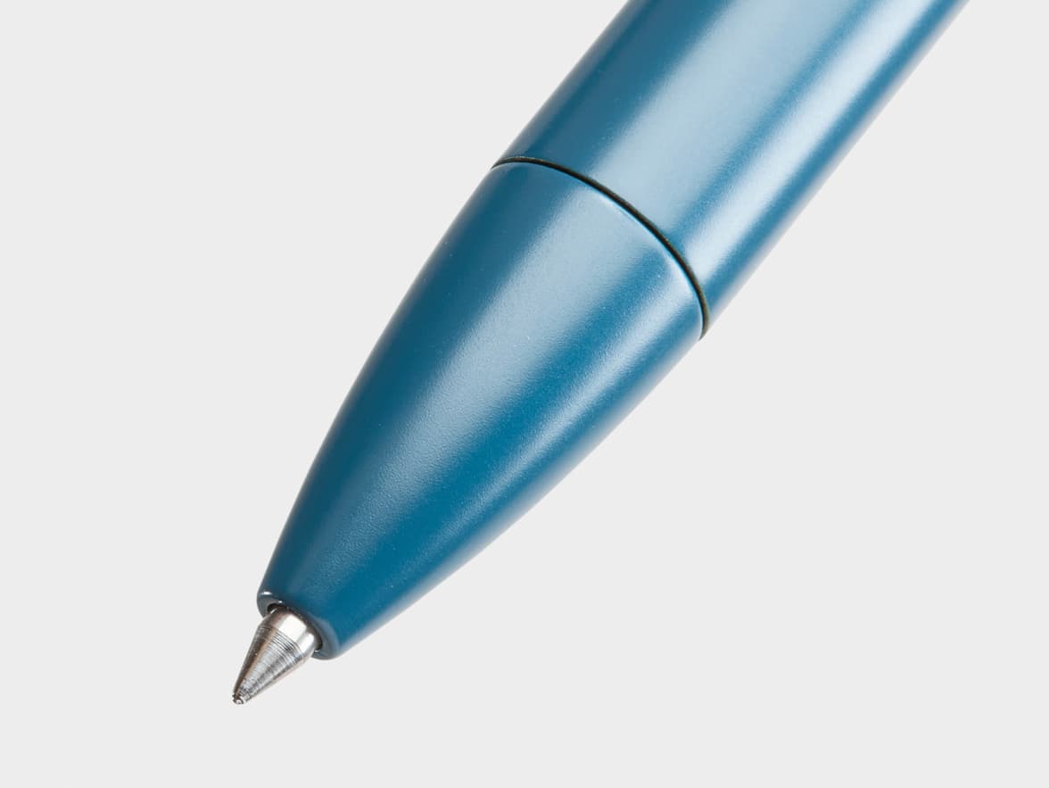 A close-up of a blue pen tip.