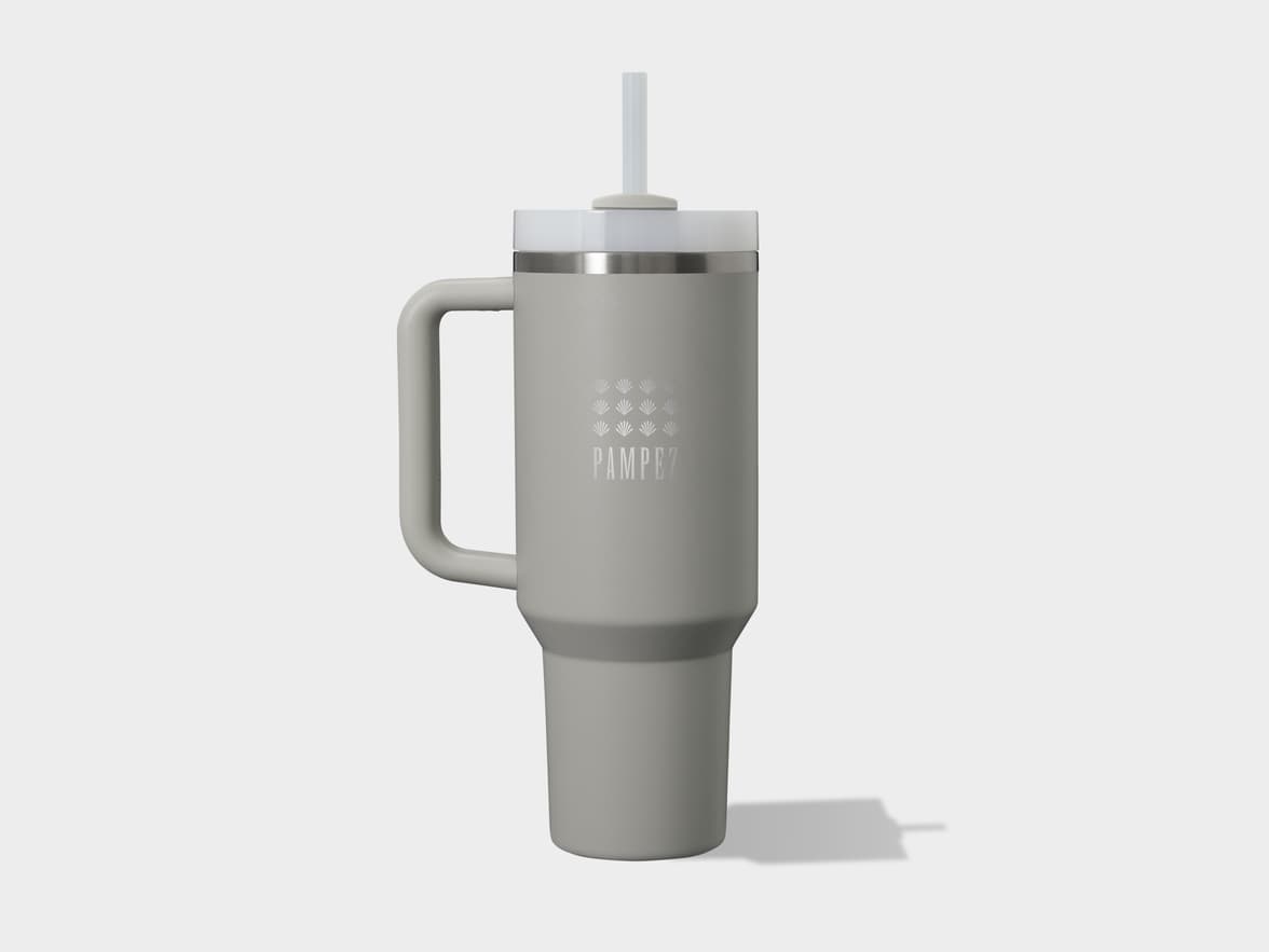 A light grey travel mug with a handle, white lid, and straw, featuring the "PAMPEZ" logo.