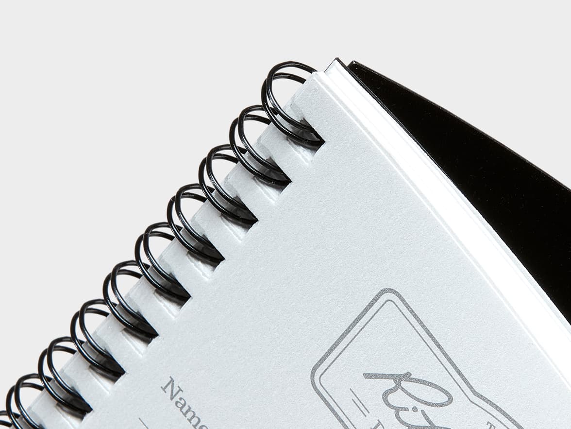 Close-up of a spiral-bound notebook page featuring 'Name' and a stylized 'Recipes' as branding.