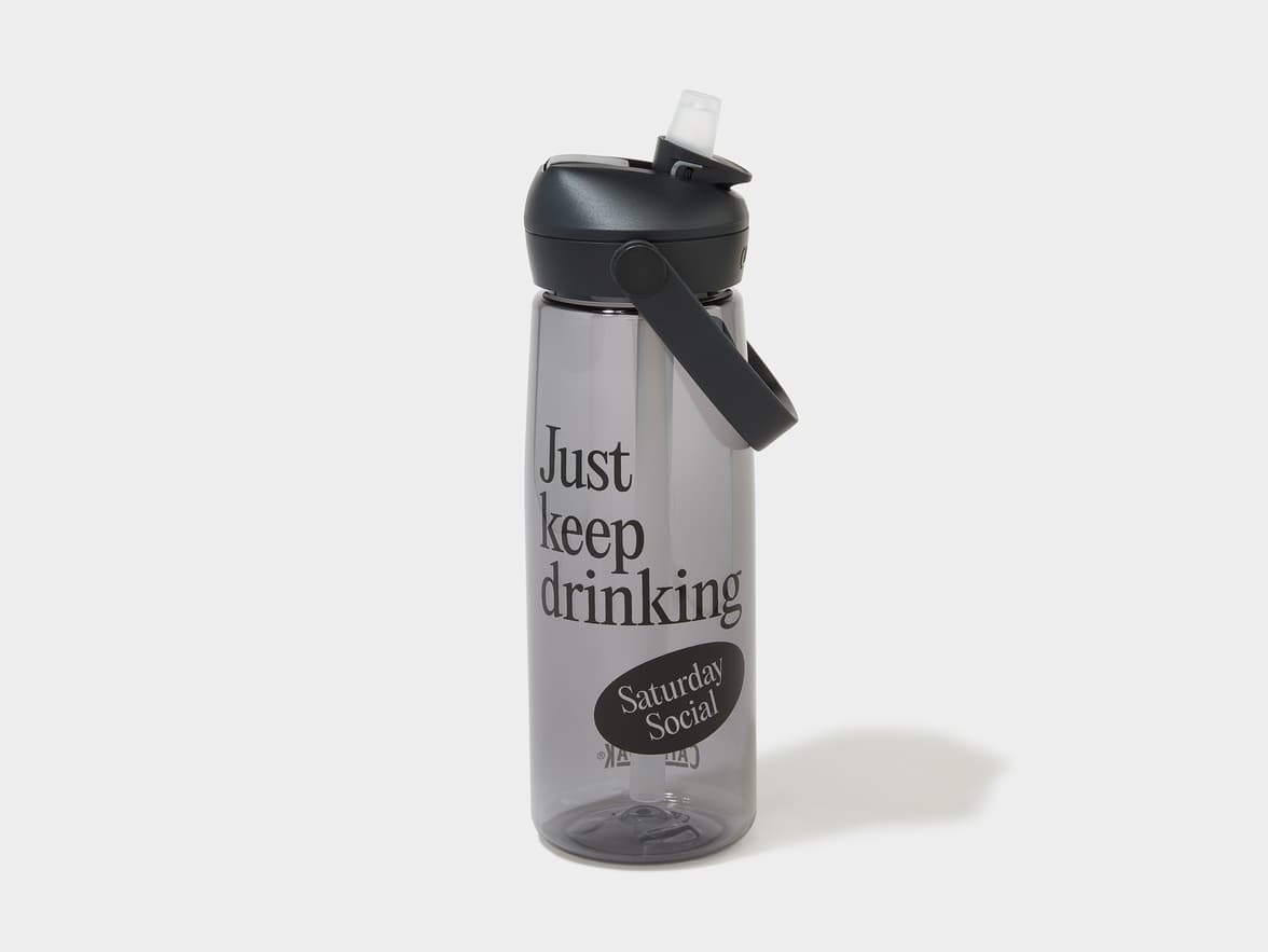 Dark grey water bottle with "Just keep drinking" and "Saturday Social" branding.