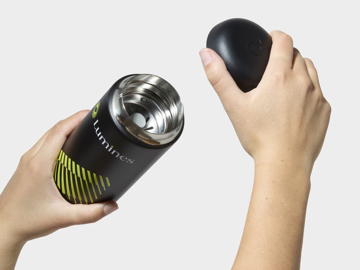 Hands Removing Lid From Matte Black Fellow® Carter Move Mug With One-Sided Printing Customisation