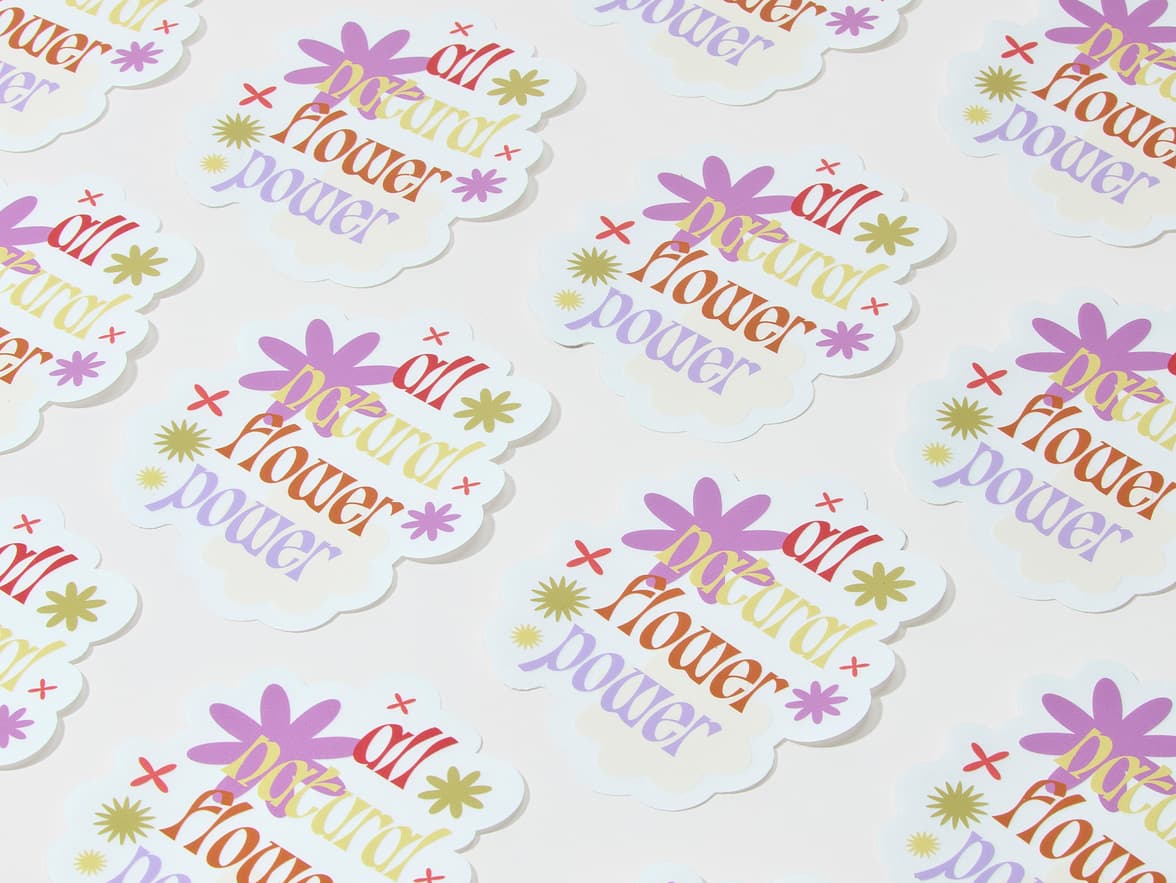 A collection of customized clear die cut stickers with flowers on them and the words 'all natural flower power'.