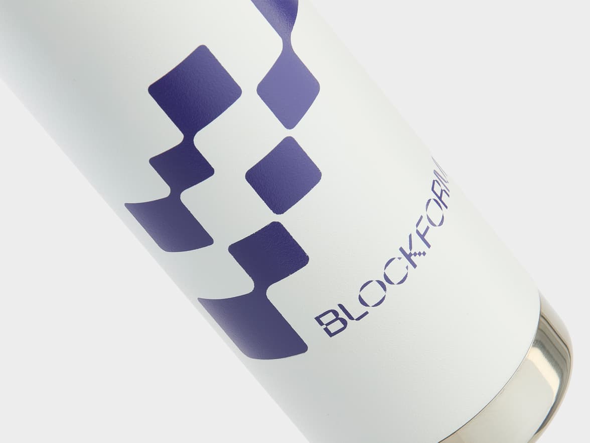 White bottle with purple BLOCKFORM logo and diamond pattern.