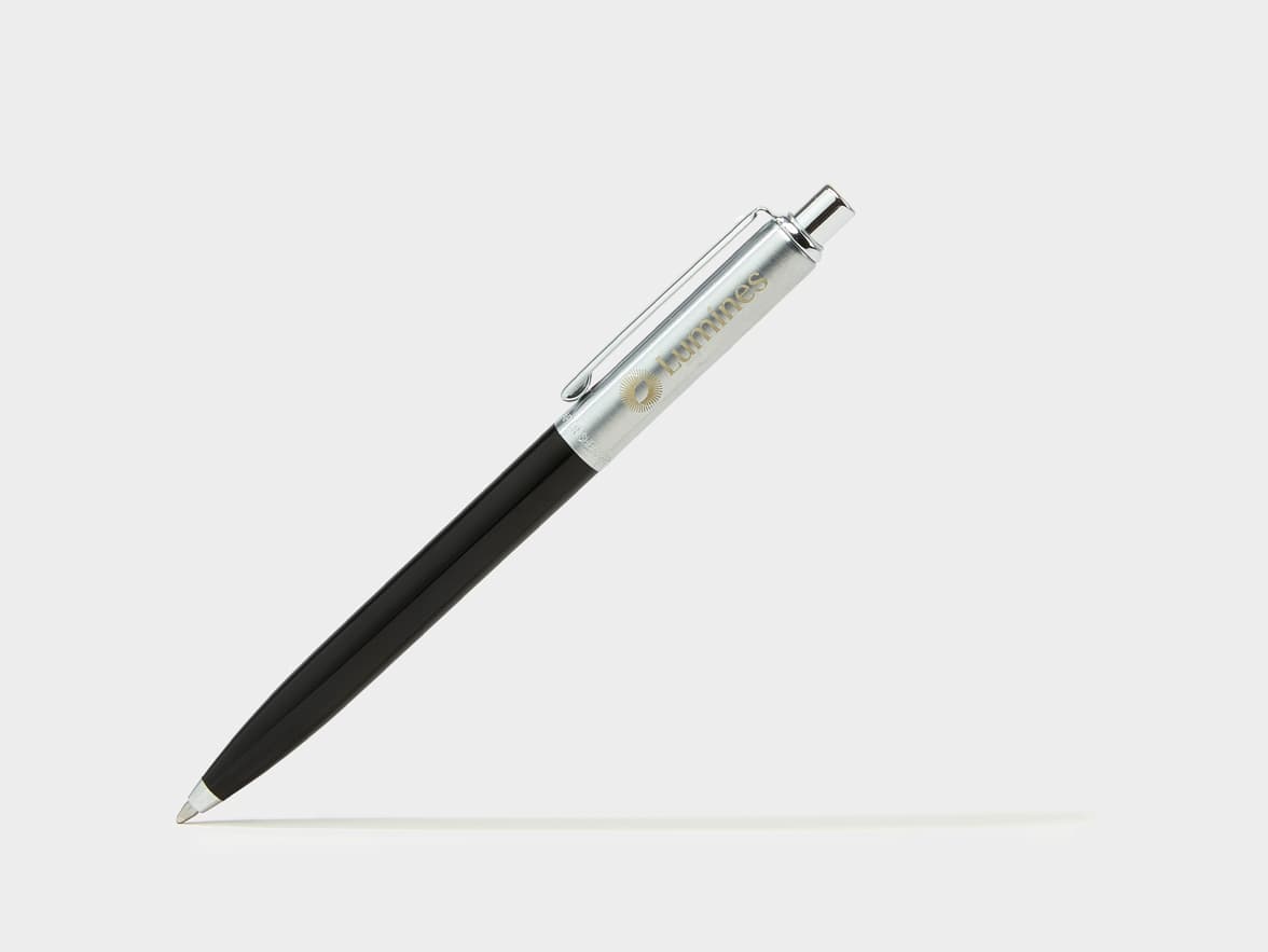 Black and silver pen with the brand name "Lumines" and a sun-like logo on its barrel.