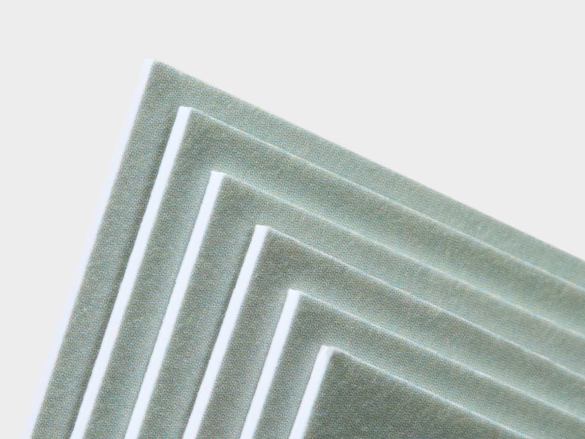 A close up image of the corners of white luxe business cards.