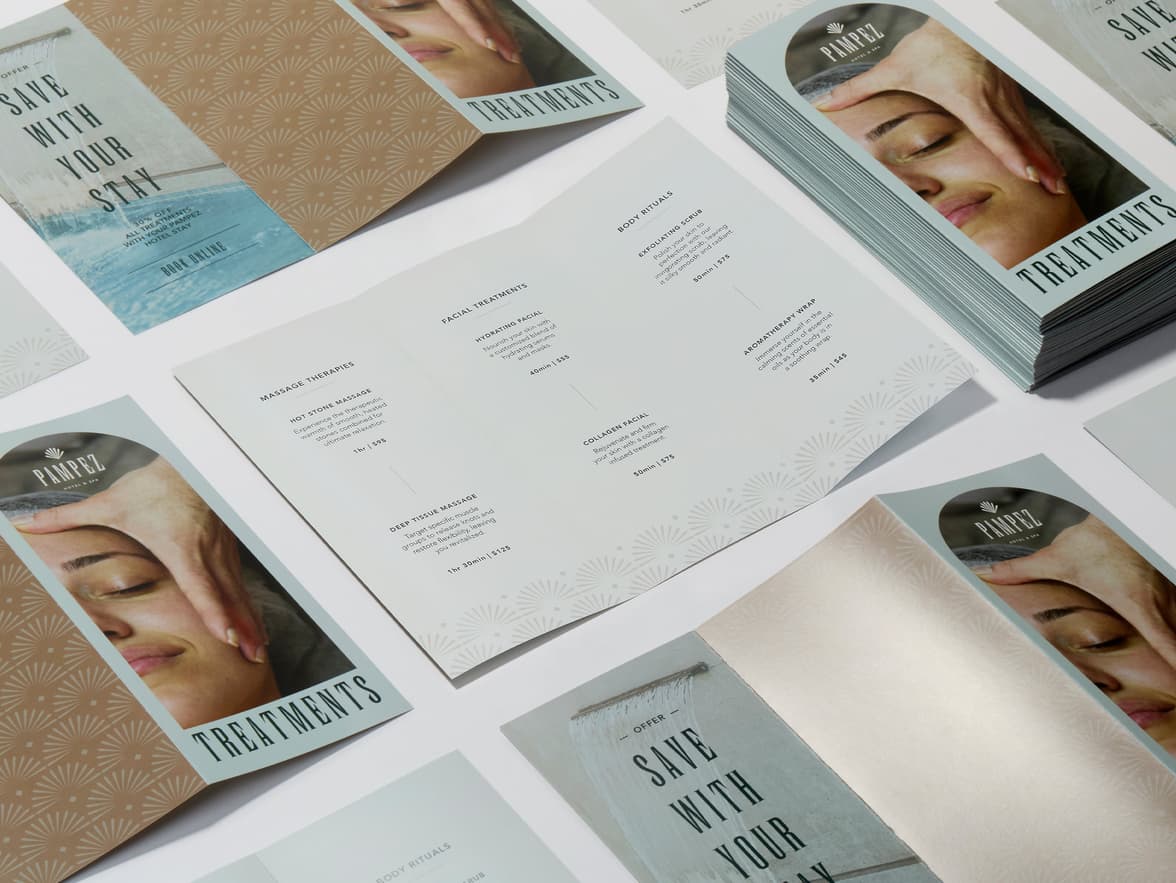 A collection of tri-fold brochures in gloss paper.