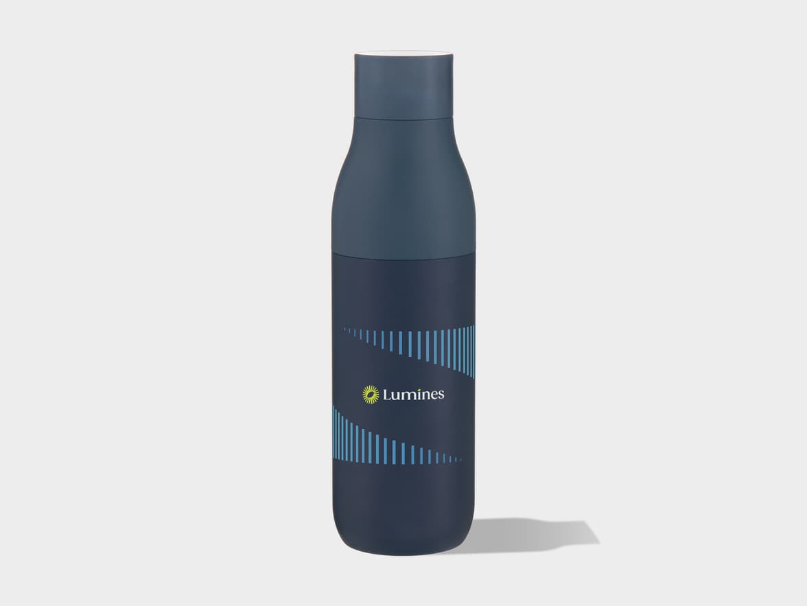 A dark blue water bottle featuring a yellow sun-like logo and 'Lumines' text, surrounded by a dynamic pattern of varying blue vertical lines, all set against a plain light gray background.