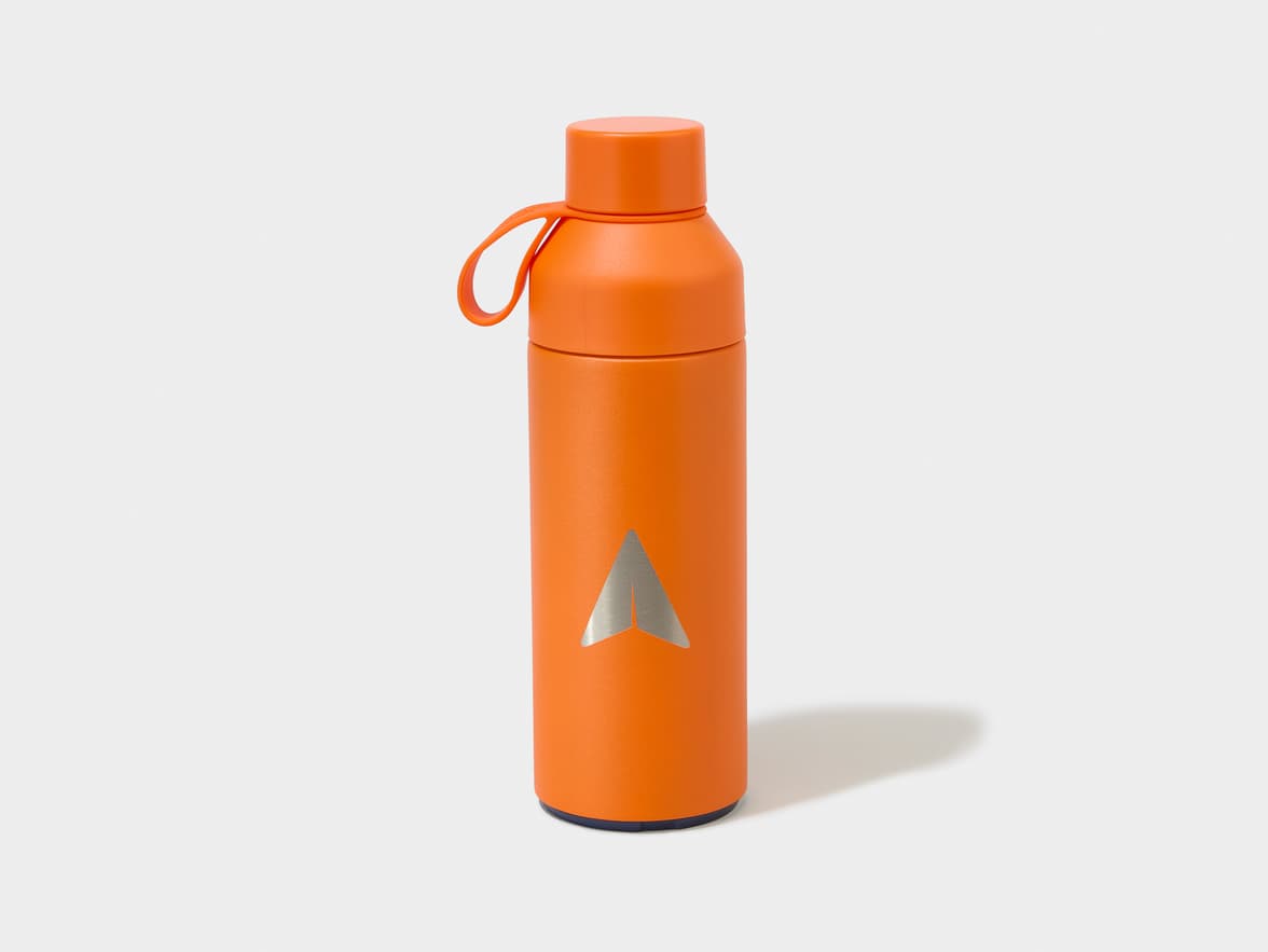 Orange water bottle with a silver arrow logo.