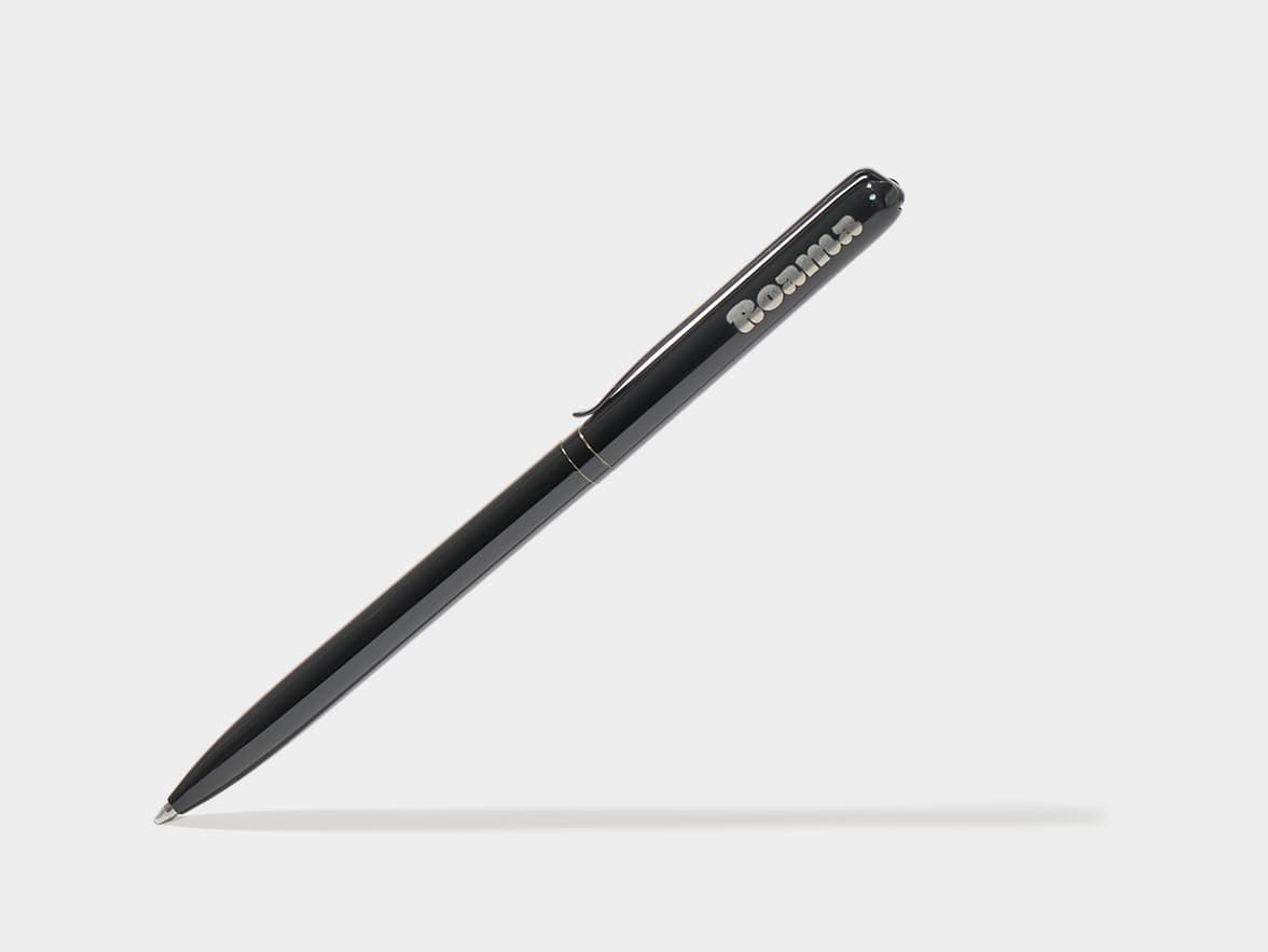 Black "Roama" branded pen.