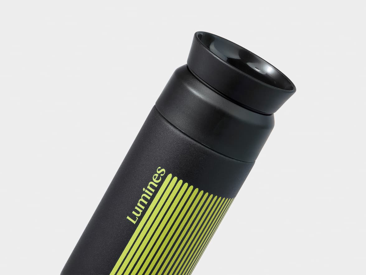 Black Lumines flask with green stripes.