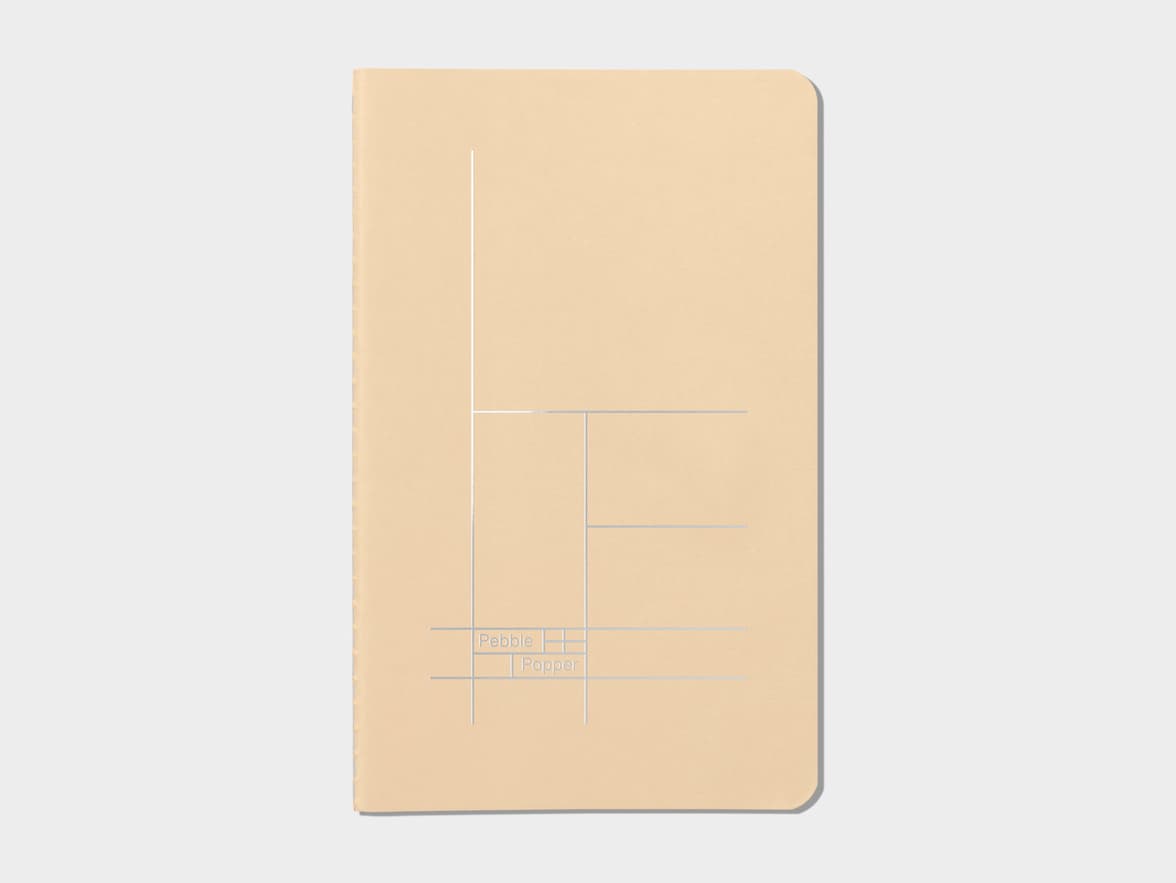 Tan soft cover journal with silver foil pattern