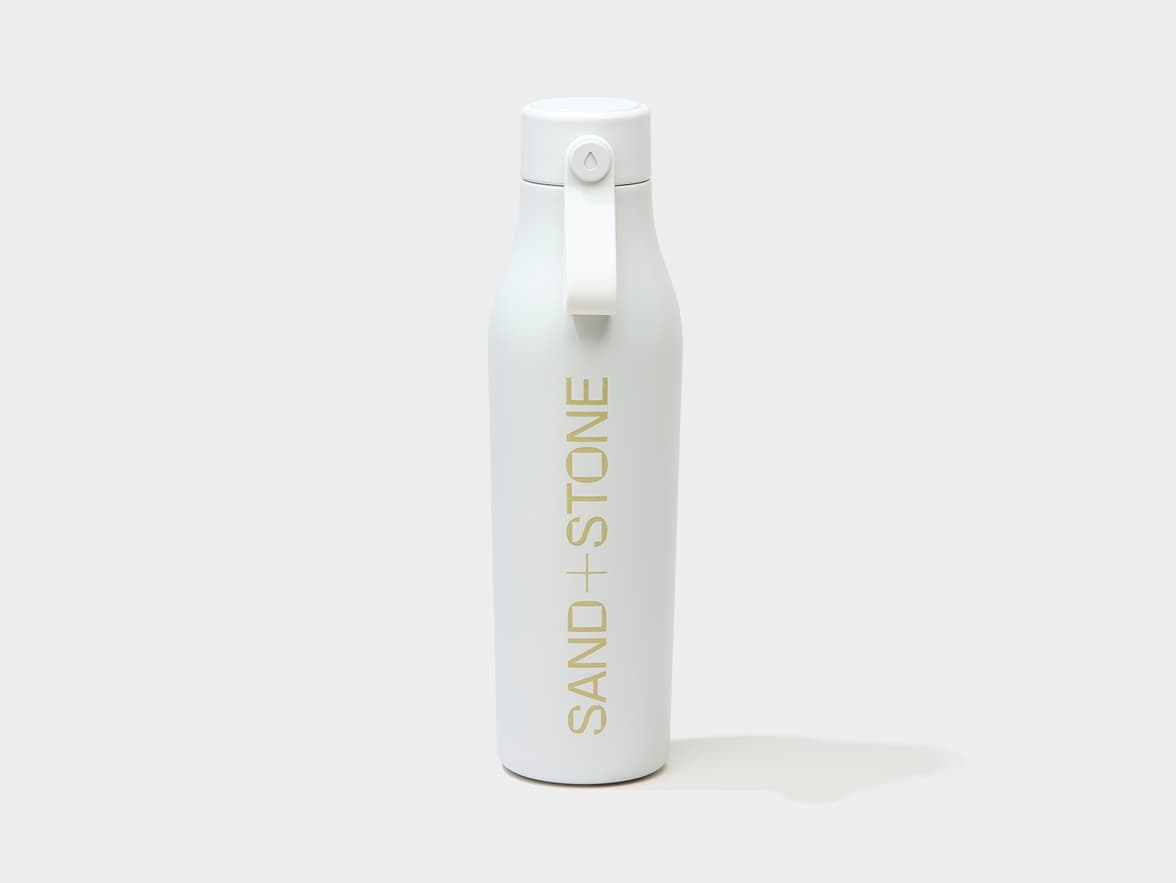 Cloud Grey water bottle with custom gold branding.