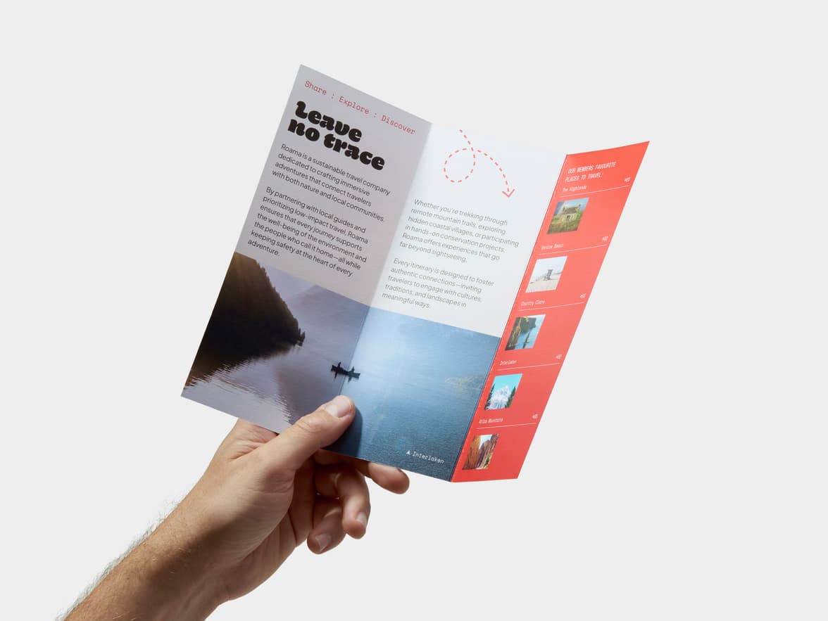 A hand holding open a Tri-Fold Eco Brochure.